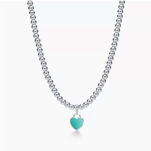 Return to Tiffany & Co® heart tag necklace in sterling silver w/ enamel finish.